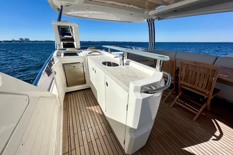  Yacht Photos Pics Luxurious 2016 Absolute 72 FLY yacht deck with outdoor kitchen and ocean view.