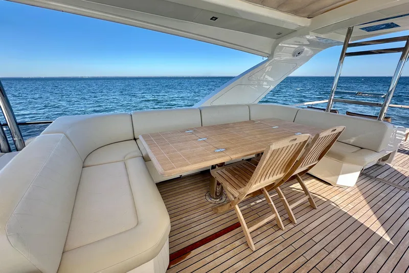  Yacht Photos Pics Luxurious outdoor seating on 2016 Absolute 72 FLY yacht with ocean view.