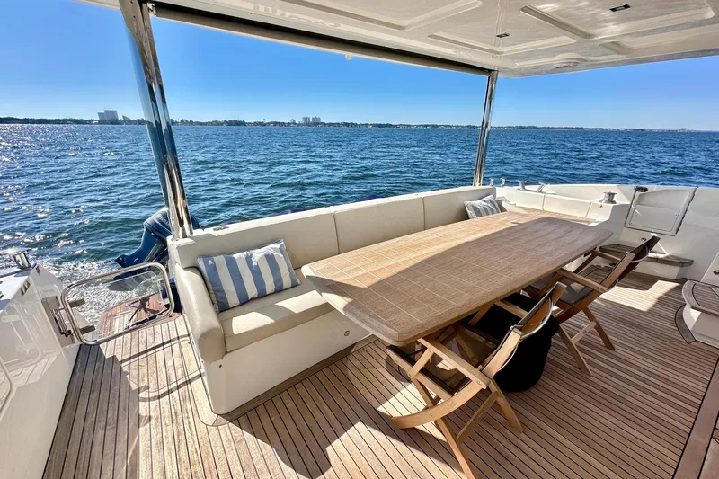  Yacht Photos Pics Luxurious 2016 Absolute 72 FLY yacht deck with seating and ocean view.