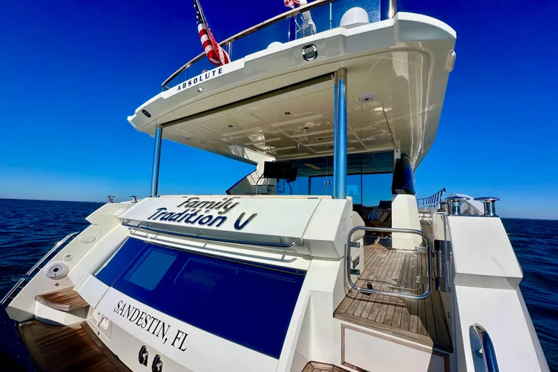  Yacht Photos Pics Luxury yacht Absolute 72 FLY 2016 on open sea, clear blue sky background.