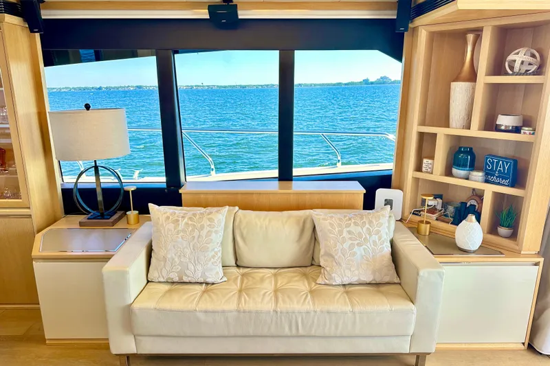  Yacht Photos Pics Luxurious interior of 2016 Absolute 72 FLY yacht with ocean view through large windows.