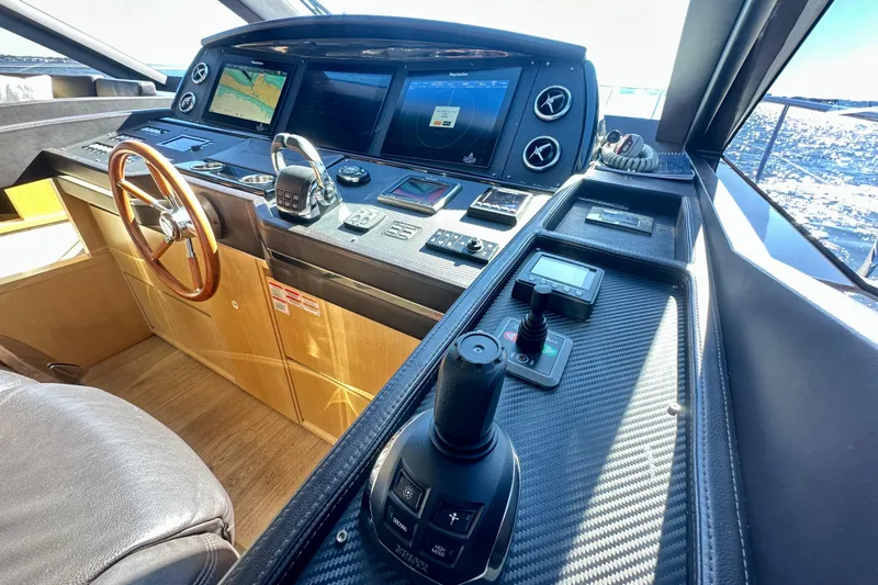  Yacht Photos Pics Cockpit of 2016 Absolute 72 FLY yacht with advanced navigation controls and displays.