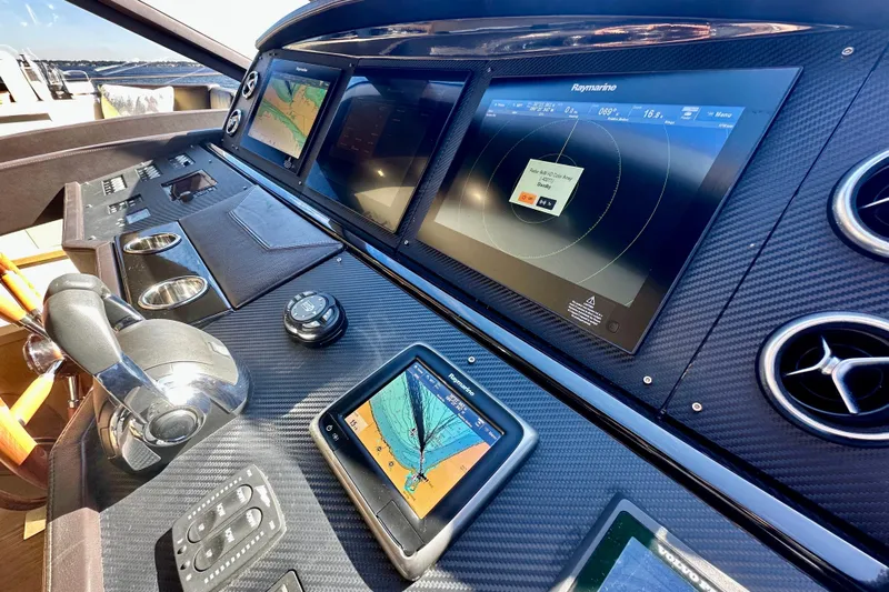  Yacht Photos Pics Cockpit of 2016 Absolute 72 FLY yacht with advanced navigation displays and controls.
