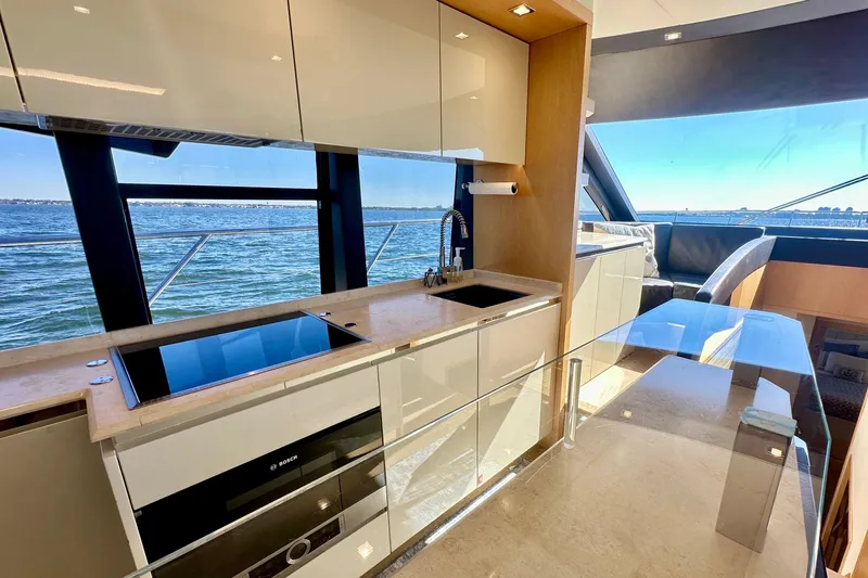  Yacht Photos Pics Luxurious kitchen interior of 2016 Absolute 72 FLY yacht with ocean view.