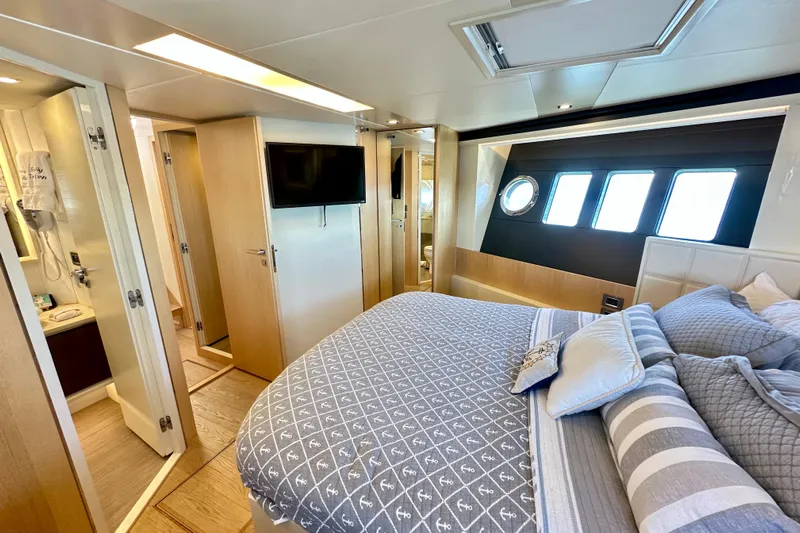  Yacht Photos Pics Luxurious bedroom interior of 2016 Absolute 72 FLY yacht with modern amenities.