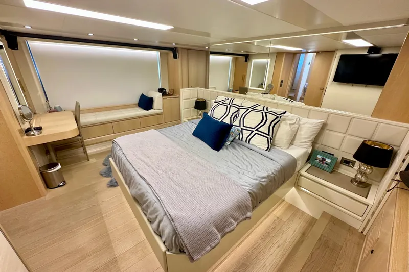  Yacht Photos Pics Luxurious bedroom interior on 2016 Absolute 72 FLY yacht with modern decor and cozy ambiance.