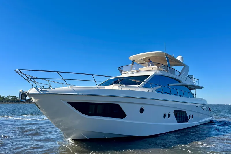  Yacht Photos Pics Luxury Absolute 72 FLY yacht cruising on open water, 2016 model.