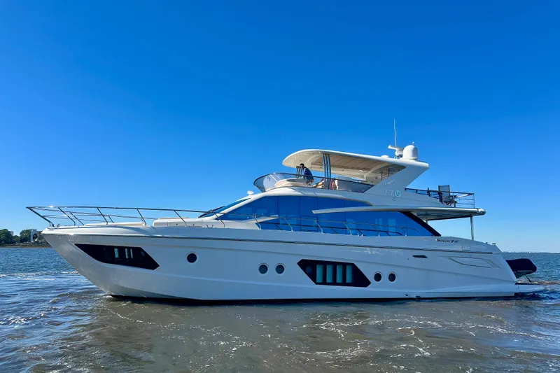  Yacht Photos Pics Luxury 2016 Absolute 72 FLY yacht cruising on clear blue waters.