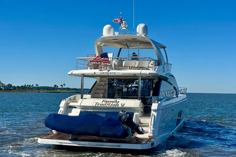  Yacht Photos Pics Luxury yacht Absolute 72 FLY 2016 cruising on open water under clear blue sky.