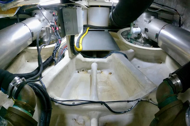  Yacht Photos Pics Engine room of 2016 Absolute 72 FLY yacht, showcasing mechanical components and wiring.