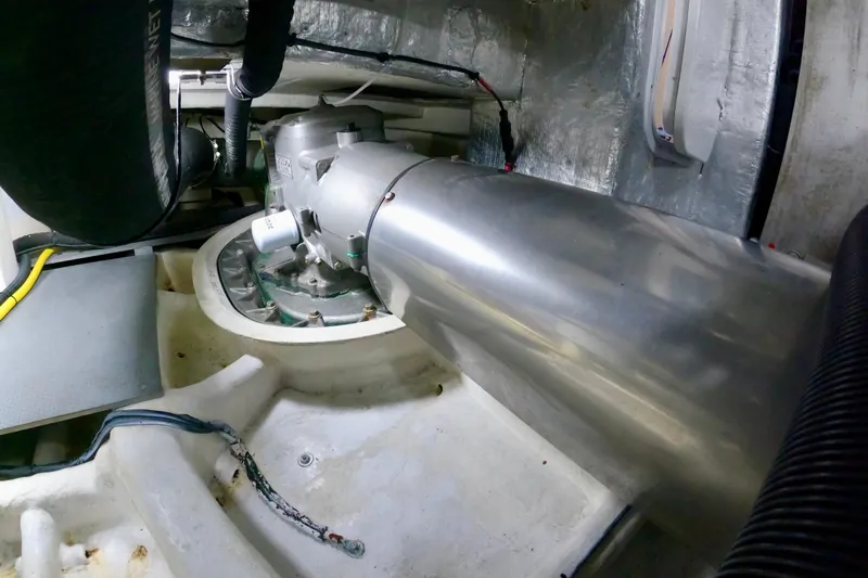  Yacht Photos Pics Engine room of 2016 Absolute 72 FLY yacht, showcasing mechanical components and piping.