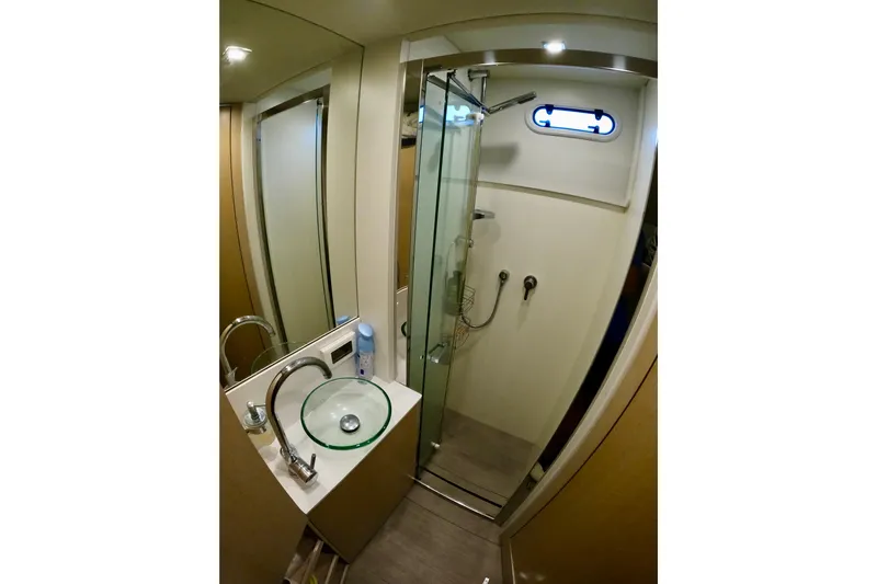  Yacht Photos Pics Luxurious bathroom in 2016 Absolute 72 FLY yacht with glass shower and modern sink.