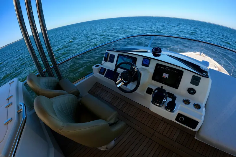  Yacht Photos Pics Cockpit view of 2016 Absolute 72 FLY yacht with ocean backdrop.