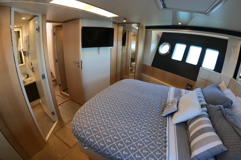  Yacht Photos Pics Luxurious bedroom interior of 2016 Absolute 72 FLY yacht with modern amenities.