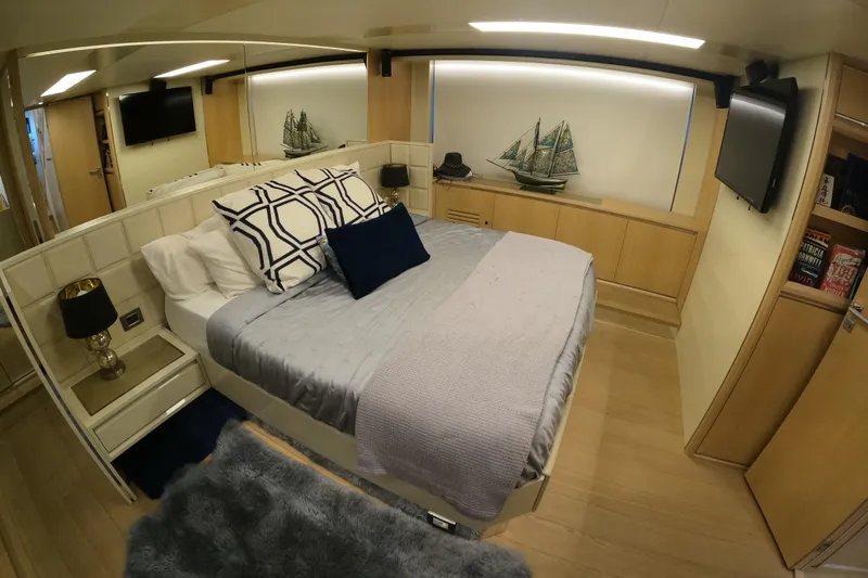  Yacht Photos Pics Luxurious bedroom interior on 2016 Absolute 72 FLY yacht with modern decor and cozy bedding.