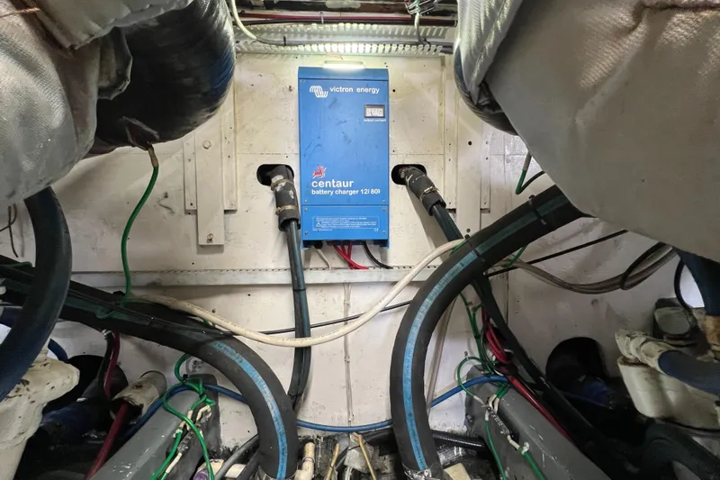  Yacht Photos Pics Engine room of 1985 Bertram 46 Convertible with Centaur battery charger and wiring.
