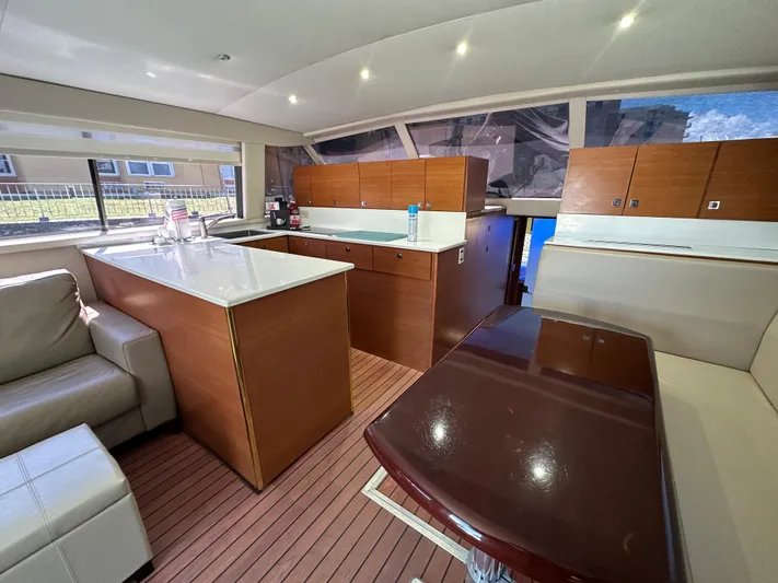  Yacht Photos Pics Interior of 1985 Bertram 46 Convertible yacht with modern kitchen and seating area.