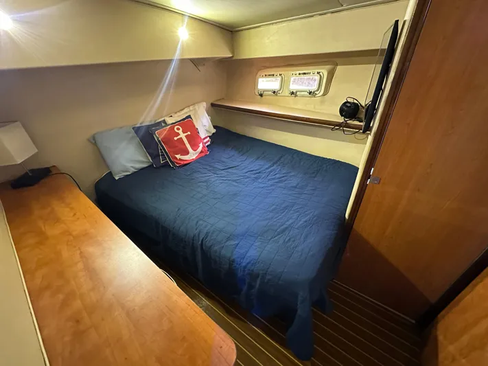  Yacht Photos Pics Cozy cabin interior of 1985 Bertram 46 Convertible with nautical-themed decor.