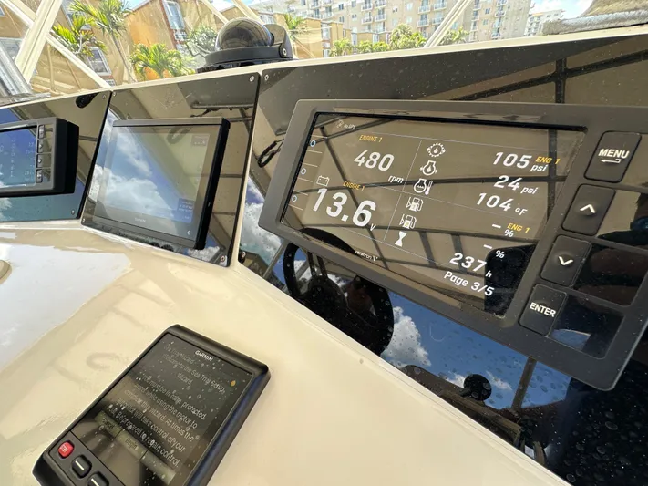  Yacht Photos Pics Control panel of a 1985 Bertram 46 Convertible yacht, displaying navigation and engine data.