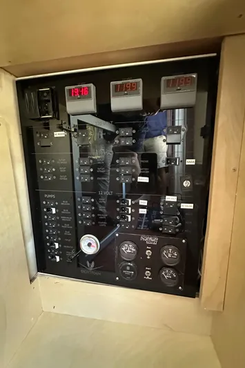  Yacht Photos Pics Electrical panel of a 1985 Bertram 46 Convertible boat, featuring gauges and switches.