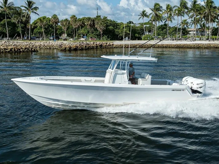 Baker Acted Yacht Photos Pics 2020 Contender 35ST boat cruising on water near palm trees.