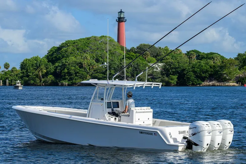 Baker Acted Yacht Photos Pics 2020 Contender 35ST boat on water with lighthouse in background.