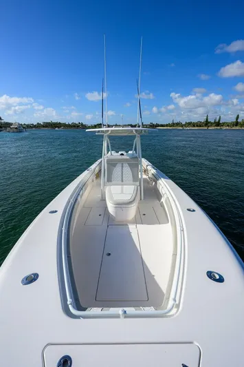 Baker Acted Yacht Photos Pics 2020 Contender 35ST boat on calm water under a clear blue sky.