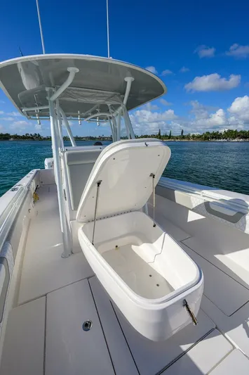 Baker Acted Yacht Photos Pics 2020 Contender 35ST boat with open storage compartment on deck.