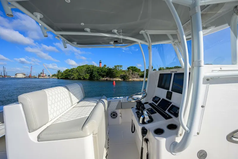 Baker Acted Yacht Photos Pics 2020 Contender 35ST boat cockpit with seating and navigation equipment.