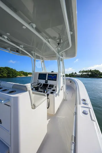 Baker Acted Yacht Photos Pics 2020 Contender 35ST boat cockpit with navigation system on a sunny day.