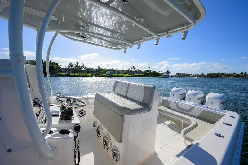 Baker Acted Yacht Photos Pics Contender 35ST 2020 model boat interior with seating and triple outboard engines.