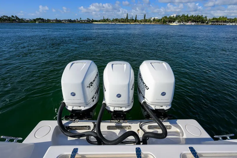 Baker Acted Yacht Photos Pics 2020 Contender 35ST boat with triple outboard motors on the water.