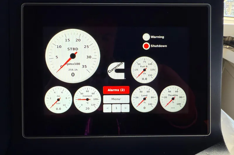  Yacht Photos Pics Dashboard display of a 2021 Itama 45 S yacht with engine gauges and alerts.