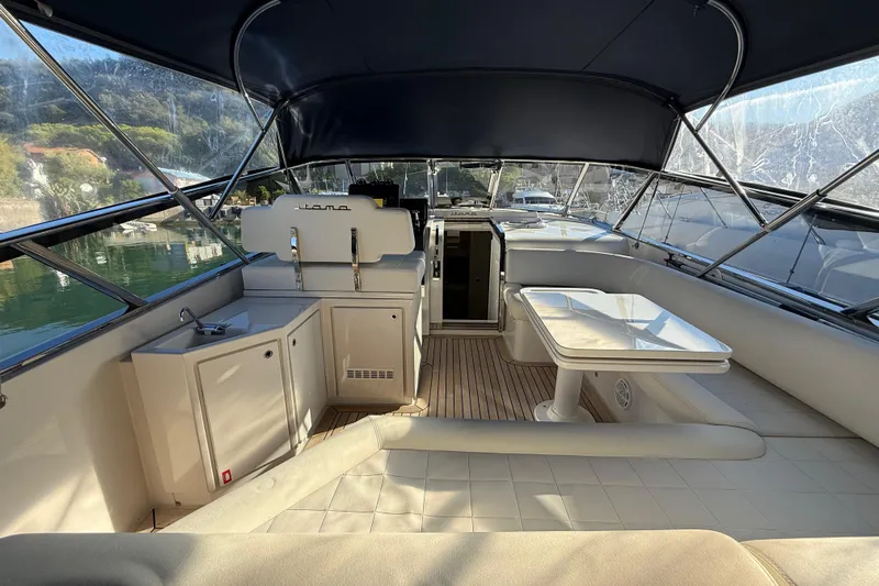  Yacht Photos Pics Luxurious interior of 2021 Itama 45 S yacht with seating and table.