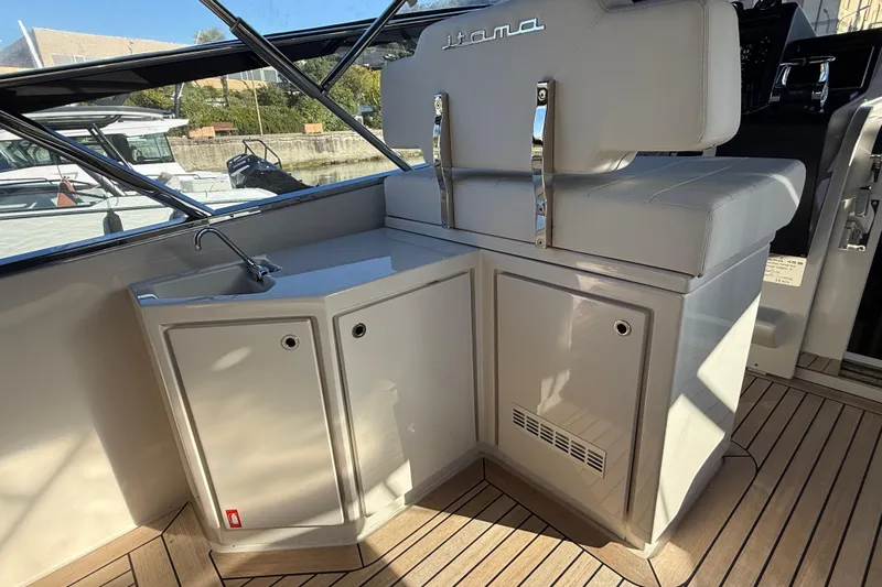 Yacht Photos Pics Interior of 2021 Itama 45 S yacht with sleek cabinetry and seating.