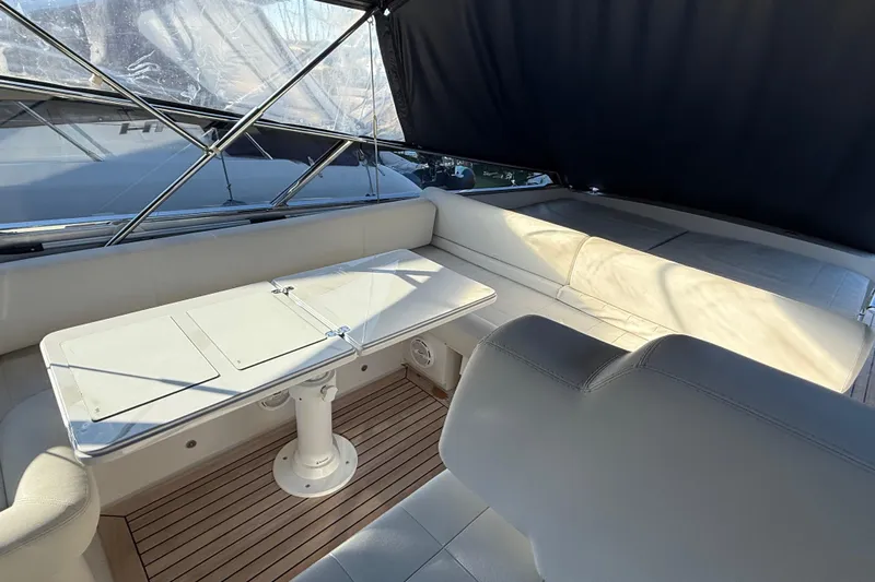  Yacht Photos Pics Luxurious interior of 2021 Itama 45 S yacht with elegant seating and table.