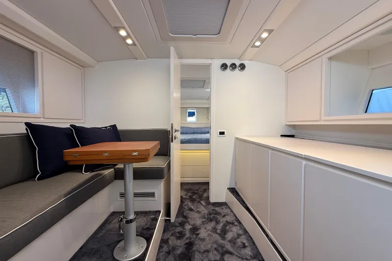  Yacht Photos Pics Luxurious interior of 2021 Itama 45 S yacht with modern seating and elegant design.