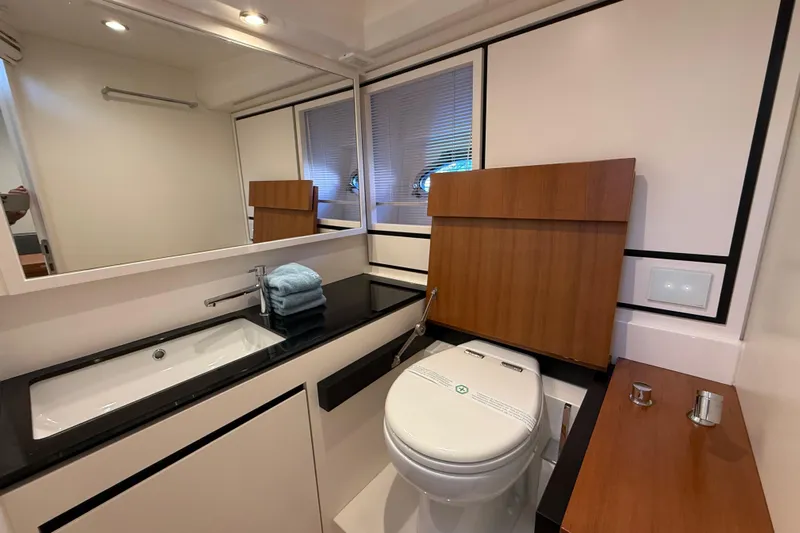  Yacht Photos Pics Luxury bathroom interior of 2021 Itama 45 S yacht with modern fixtures.