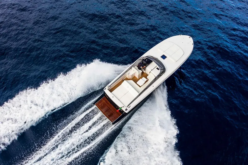  Yacht Photos Pics Aerial view of 2021 Itama 45 S yacht cruising on open sea.