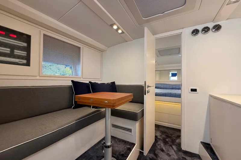  Yacht Photos Pics Luxurious interior of 2021 Itama 45 S yacht with modern seating and cozy bedroom.