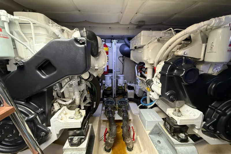  Yacht Photos Pics Engine room of 2021 Itama 45 S yacht, showcasing dual engines and mechanical components.