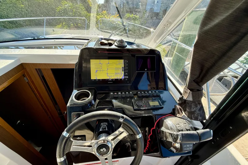  Yacht Photos Pics Cockpit of 2022 Beneteau Antares 9 with navigation system and steering wheel.