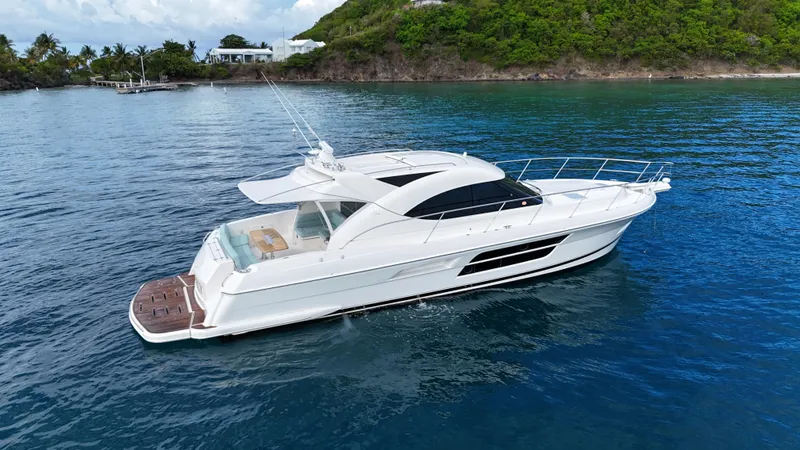  Yacht Photos Pics 2016 Riviera 5000 Sport Yacht cruising in scenic coastal waters.