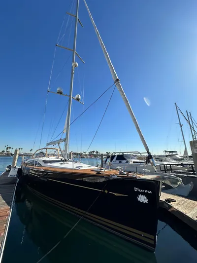 Dharma Yacht Photos Pics 2013 Jeanneau 57 sailboat docked in sunny marina.