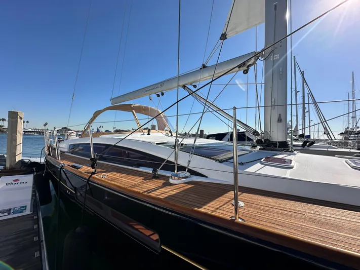 Dharma Yacht Photos Pics 2013 Jeanneau 57 sailboat docked under clear blue sky.