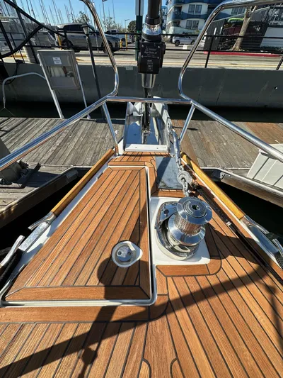 Dharma Yacht Photos Pics Jeanneau 57 sailboat deck, 2013 model, featuring teak wood and stainless steel fittings.