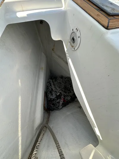 Dharma Yacht Photos Pics Anchor locker of 2013 Jeanneau 57 sailboat with chain and rope.