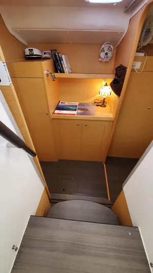 Blue Mind Yacht Photos Pics Interior of 2018 Lagoon 380 S2 yacht with wooden cabinetry and cozy lighting.