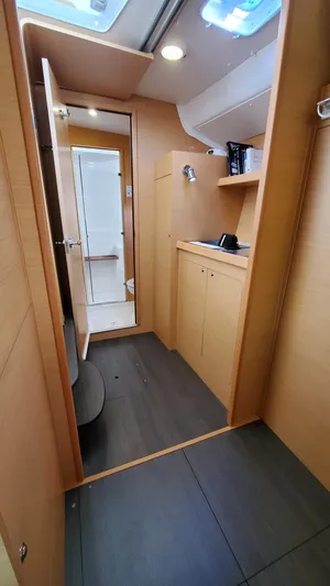 Blue Mind Yacht Photos Pics Interior of 2018 Lagoon 380 S2 yacht, featuring modern wood cabinetry and sleek design.