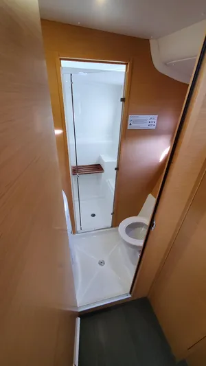 Blue Mind Yacht Photos Pics Compact bathroom in 2018 Lagoon 380 S2 yacht with shower and toilet.